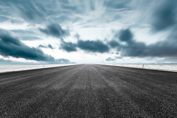 istock asphalt road and sea on a blue typhoon day 896016186
