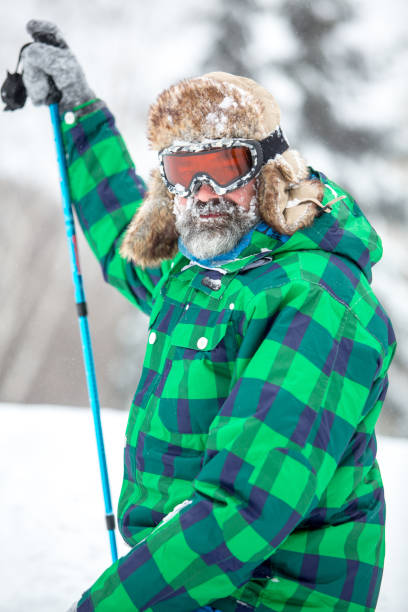 istock Man hiking through mountain snow in Colorado 896021892