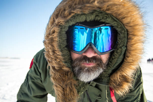 istock Man hiking through mountain snow in Colorado 896022378