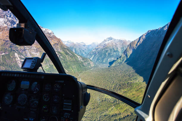 Scenic helicopter flight with view from cockpit,  Milford Sound , Fiordland National Park, South Island, New Zealand. Scenic helicopter flight with view from cockpit,  Milford Sound , Fiordland National Park, South Island, New Zealand. milford sound photos stock pictures, royalty-free photos & images