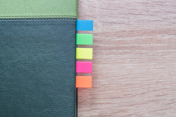 istock personal organizer with multicolored bookmarks on wooden table 896040434