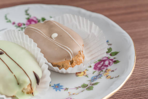 istock french eclairs on colorful porcelain plate on wooden table. 896040558