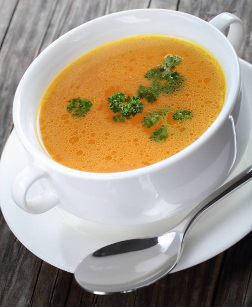 istock Chicken broth with parsley in a soup cup 896045802