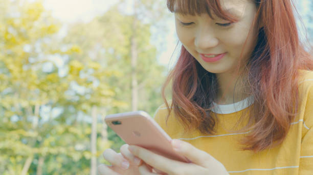 istock Woman using smart phone at outdoor 896048874