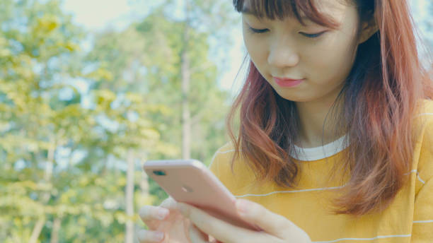 istock Woman using smart phone at outdoor 896048878