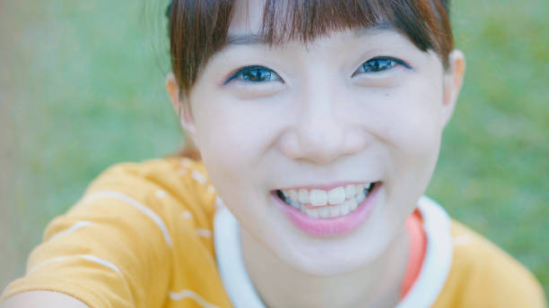 istock Young woman looking at camera 896049056