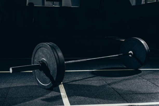 istock barbell with weights on floor in gym 896053328