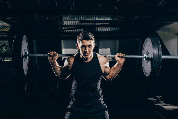 istock sportsman lifting a barbell 896053422