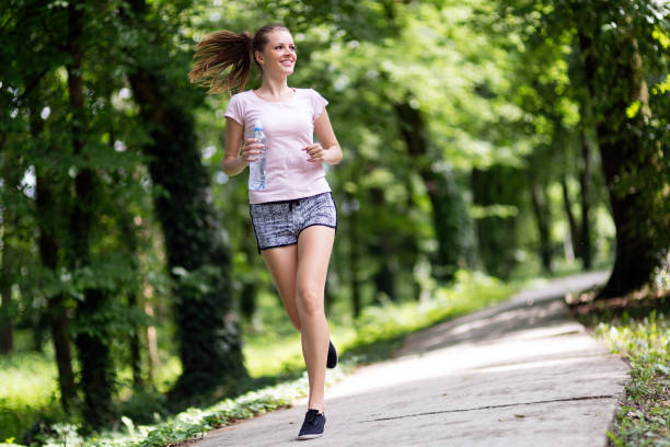 istock Beautiful jogging woman in nature 896058432
