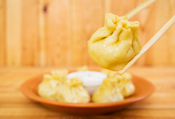 istock Delicious manti dumplings on wooden background 896061506