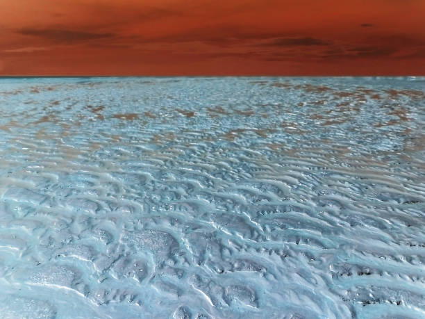 White isolation: permafrost landscape in the red sunset