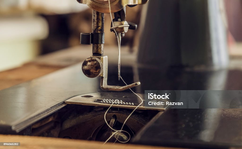 Vintage Sewing Machine Close-up image of the needle of a vintage sewing machine. Sewing Machine Stock Photo