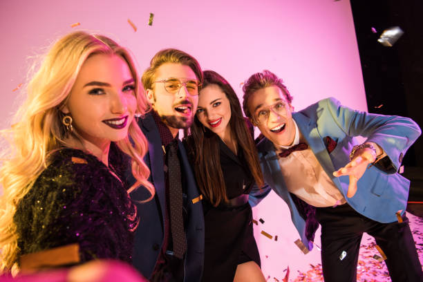 istock smiling glamorous friends on party 896065372