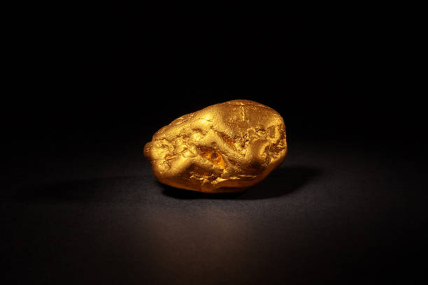 Closeup of big gold nugget on a black background
