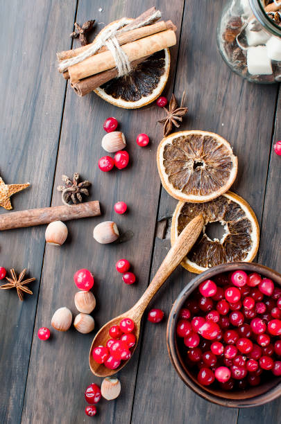 istock juicy cranberries in a plate and spice on wood table 896077046