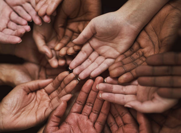 Pledge your support Shot of a group of hands held cupped out together sea of hands stock pictures, royalty-free photos & images