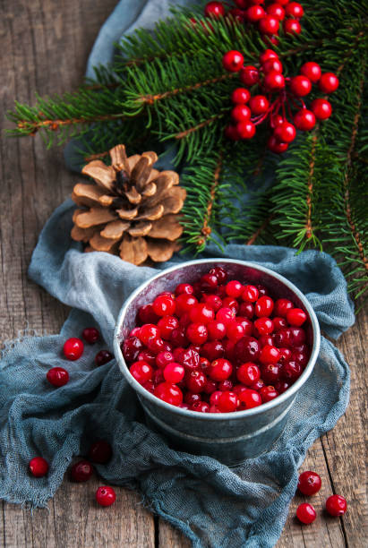 istock Red cranberries on a old wooden table 896083498