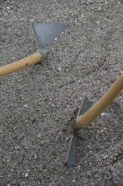istock shovels in the sand 896084004