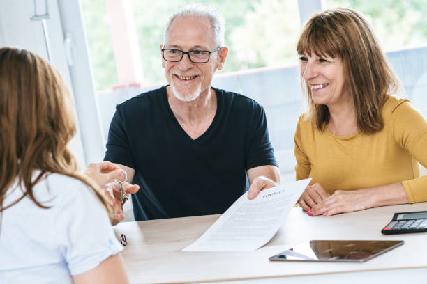 istock Senior couple meeting real estate agent 896089496