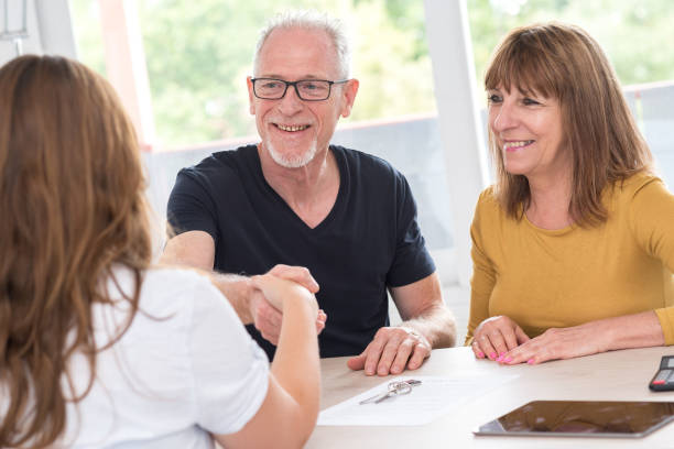 istock Senior couple meeting real estate agent 896093206
