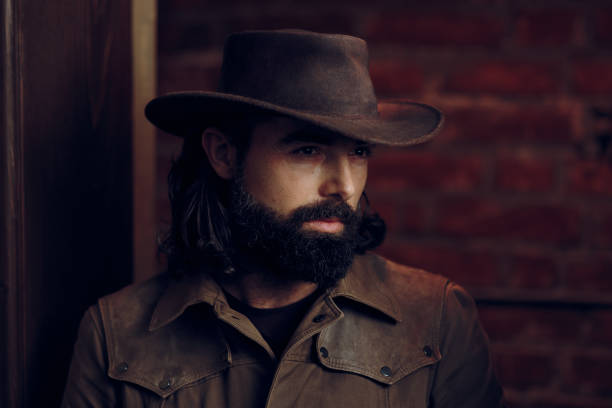 istock Handsome Man Wearing Cowboy hat in western style portrait 896097364