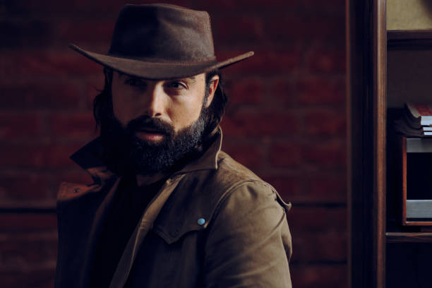 istock Handsome Man Wearing Cowboy hat in western style portrait 896098400
