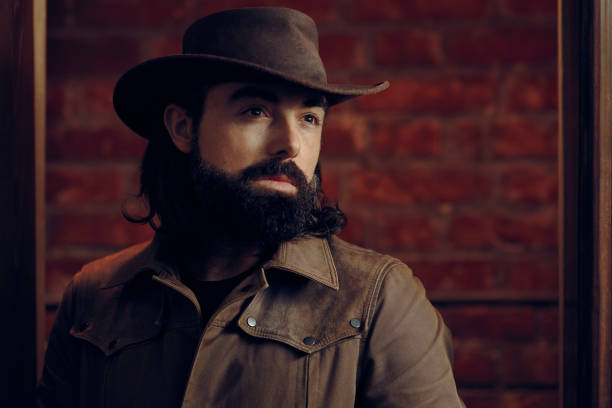 istock Handsome Man Wearing Cowboy hat in western style portrait 896098444