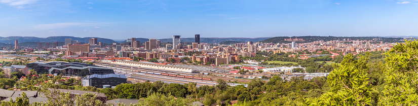 Pretoria / Tshwane panoramic facing the Union Buildings seen in the distance, with Statistics SA building seen on the bottom left, the Railway Station with Gauteng metro station.