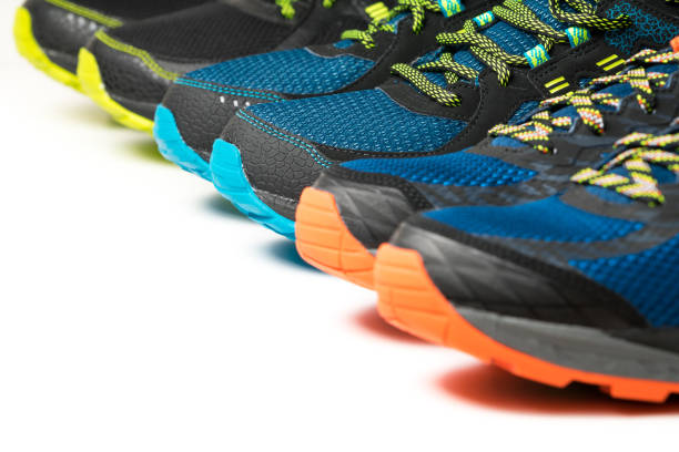 istock Three pairs of exercise trainers / running shoes on a white background 896105148