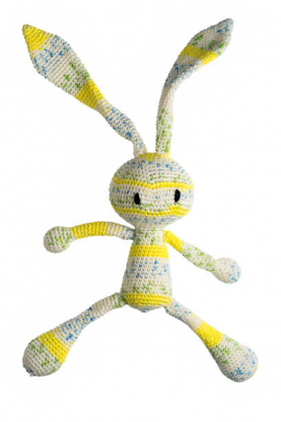 istock amigurumi crocheted yellow stripped rabbit toy isolated on white background 896107434