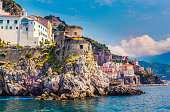 Scenic picture-postcard view of the beautiful town of Amalfi at famous Amalfi Coast with Gulf of Salerno, Sorrento, Italy