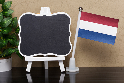 Flag of Netherlands and Blackboard with copy space