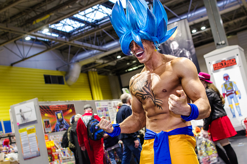 Cosplayer dressed as Goku in his Supersaiyen Blue form from Dragon Ball at Birmingham MCM Comic Con.