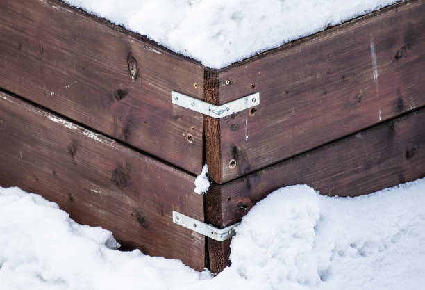 istock close up of wooden case covered with snow, creative design 896130778