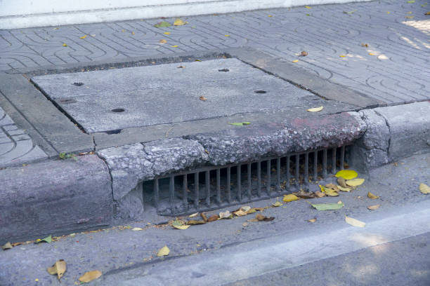 istock Water drainage old on the way and fallen leaves 896144264
