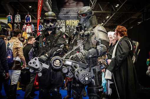 Cosplayers dressed as characters from the movie/video game 'Resident Evil' and the video game 'Army of Two' at Birmingham MCM Comic Con.