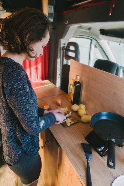 istock Woman cooking fried potato in the van 896148604