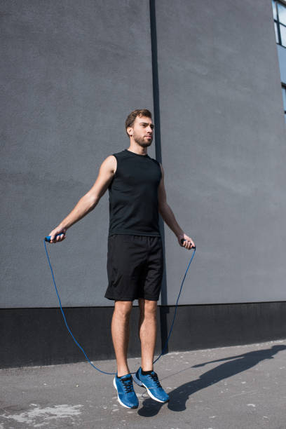 istock athletic sportsman jumping with rope 896149112