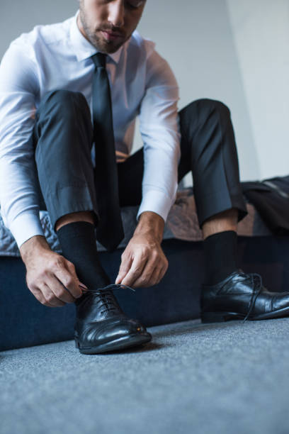 istock Businessman tying shoelaces 896151334