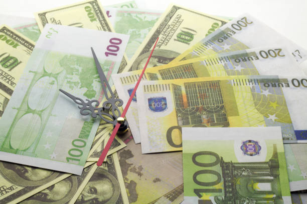 istock Euro money and watch hands 896154124
