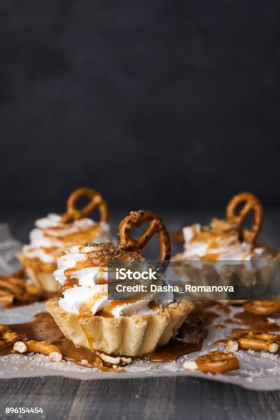 Homemade Cupcakes With Salted Caramel And Pretzels Stock Photo - Download Image Now
