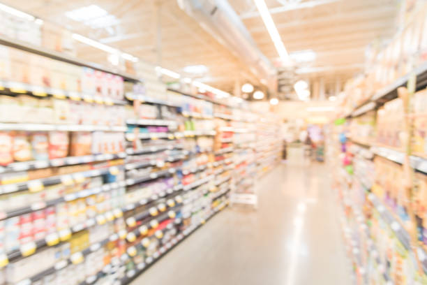 istock Blurred baking supplies, jams and nut butters in retail store 896154844