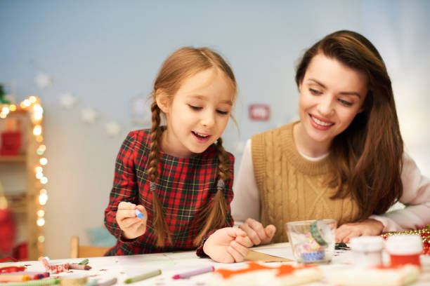 istock Enjoying Process of Making Christmas Decoration 896157440