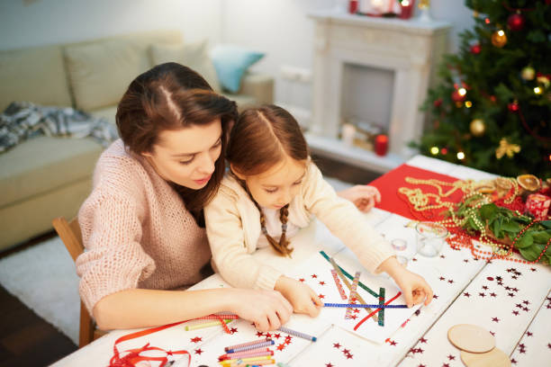 istock Loving Family Making Christmas Decoration 896157494