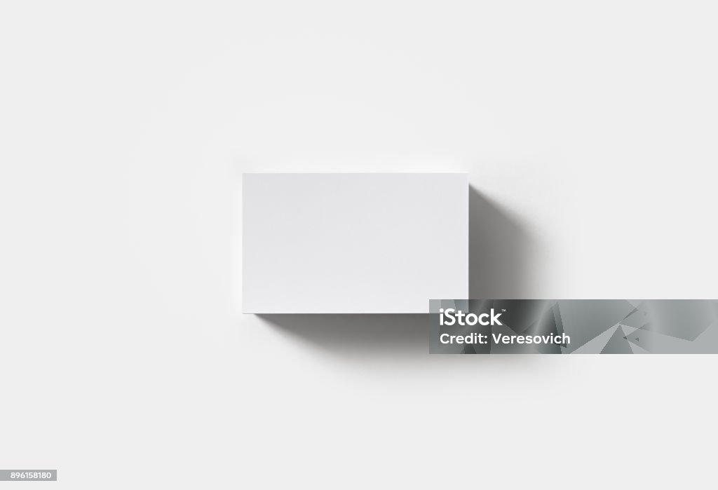 Blank business cards Stack of blank business cards on white paper background. Flat lay. Business Card Stock Photo