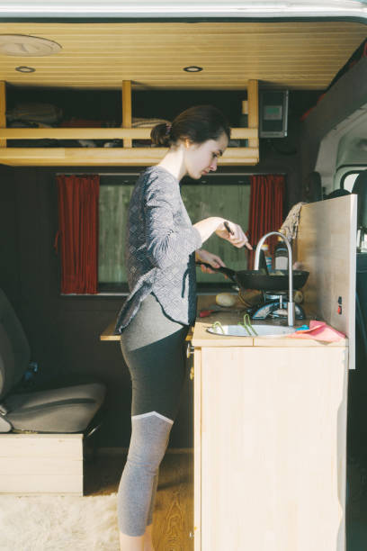 istock Woman cooking fried potato in the van 896160926