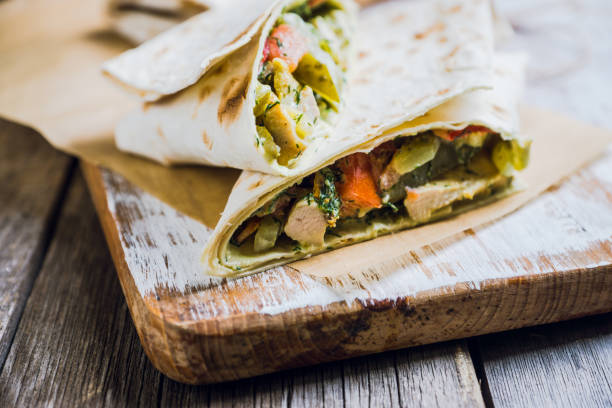 istock Shawarma with sauce on the rustic wooden background 896161566