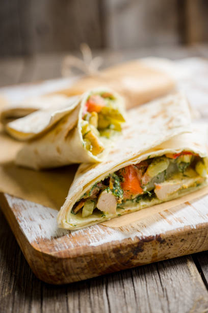 istock Shawarma with sauce on the rustic wooden background 896161572