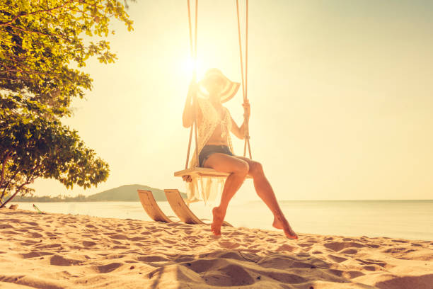 istock Woman at tropical swing 896162006