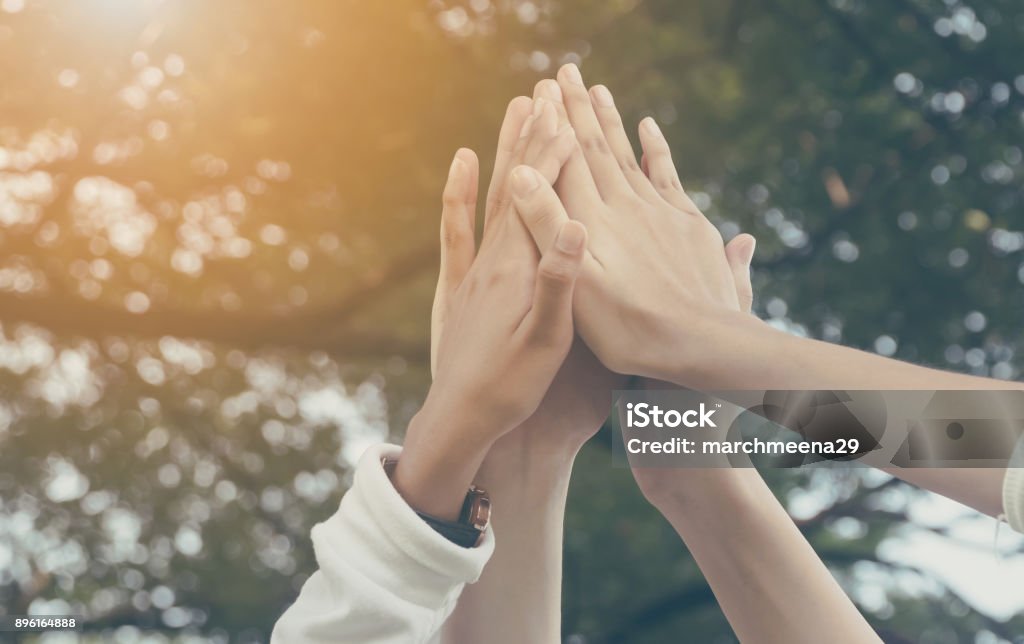 Team work and together concept, Hand of people high five for tag team Women Stock Photo